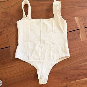 Shinestar Cream Ribbed Scoop Bodysuit